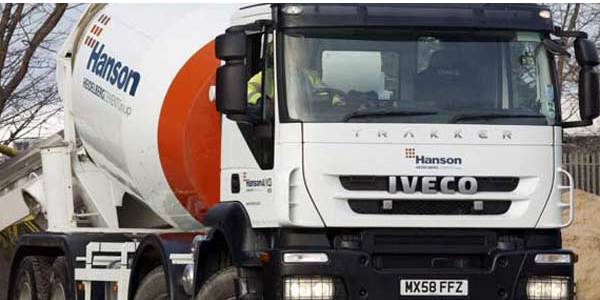leaning ready-mix truck with the Orange-crete brushes